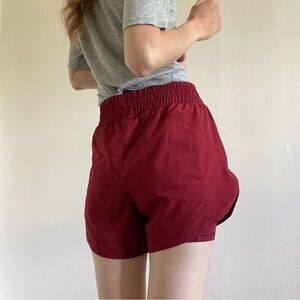Running shorts with tights underneath and with pockets on both sides.